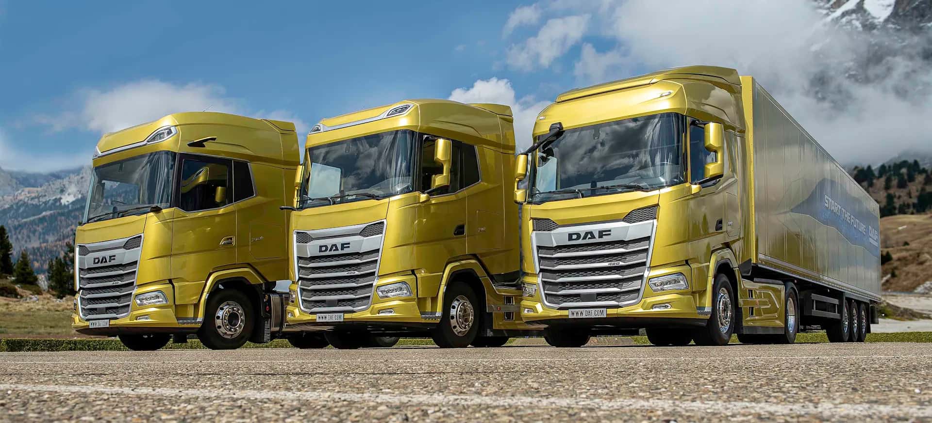 Commercial trucks and vans lined up on the road